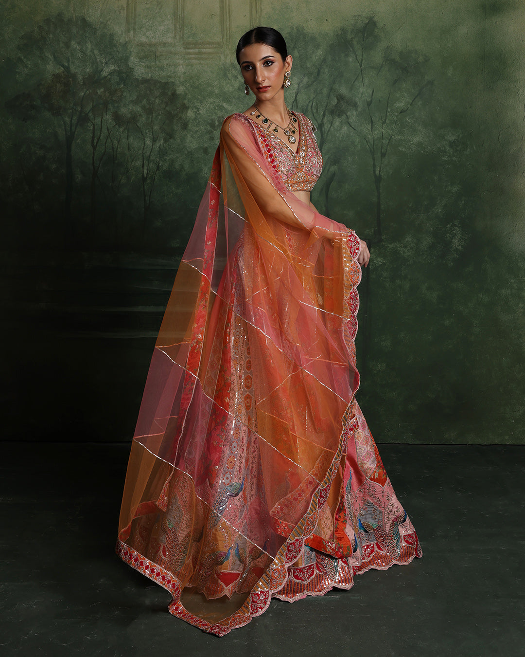 Vibrant Sunset Hues With Peacock Border Lehenga Set