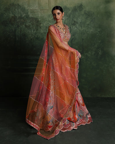 Vibrant Sunset Hues With Peacock Border Lehenga Set