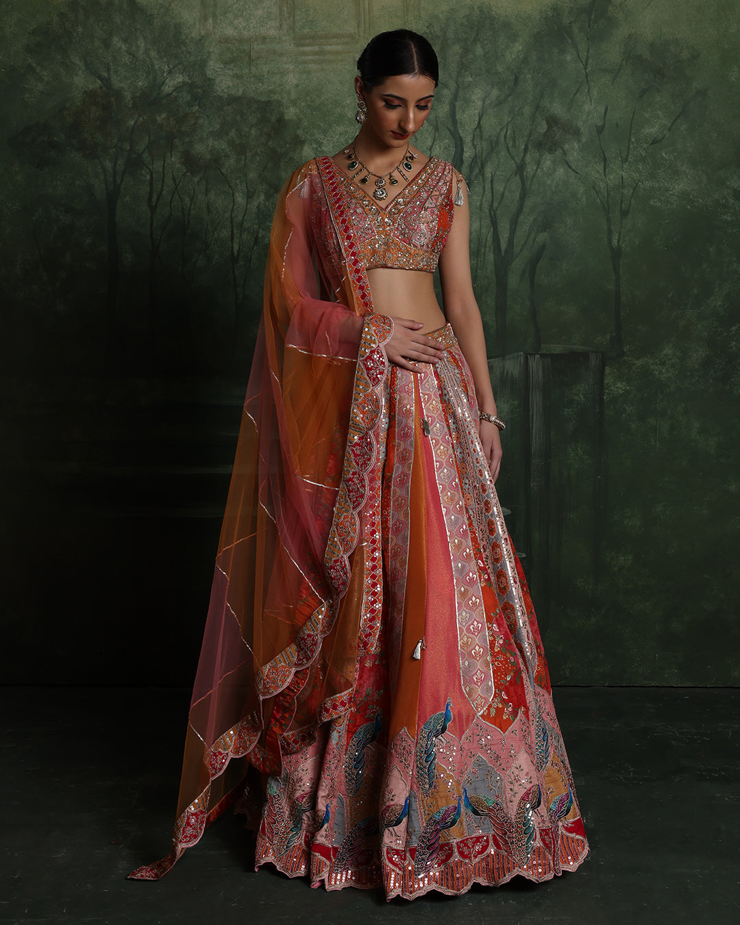 Vibrant Sunset Hues With Peacock Border Lehenga Set